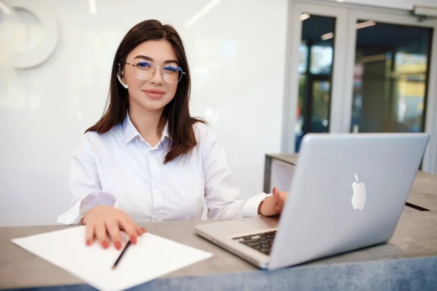 Attractive Female Receptionist At The Check-In Desk of their Computer Repair Shop in Montclair, NJ